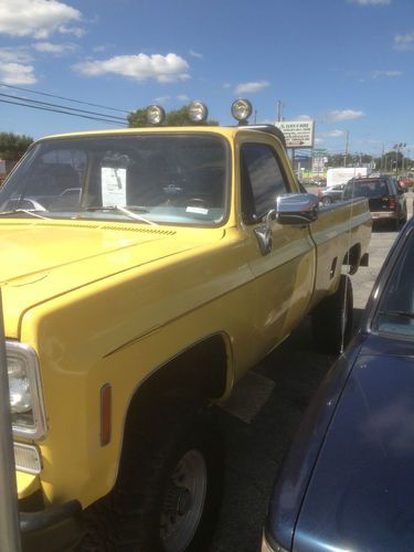 1977 chevy pickup, yellow, low miles, jacked up, lift kit  58,000 miles
