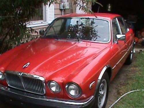 1984 cherry red jaguar, leather interior non running rebuilt title ran then quit