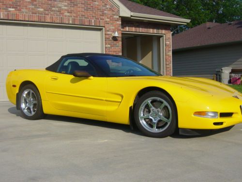 2001 chevrolet corvette convertible. yellow with black. excellent with extras!