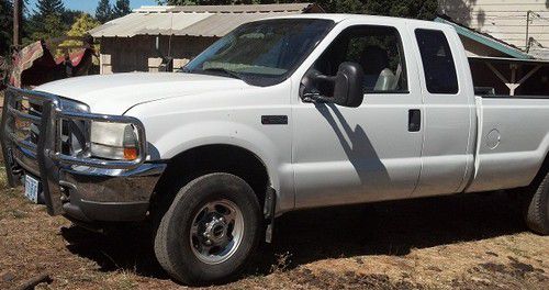 Quad cab, 4x4, white, runs and drives great,  both goose &amp; bumperhauling hookups
