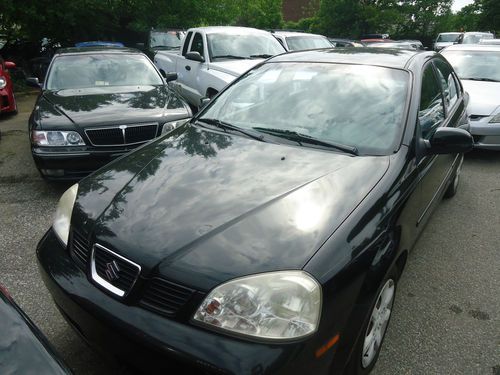 2005 suzuki forenza has good milleage iit has a dent on right finder tow it away