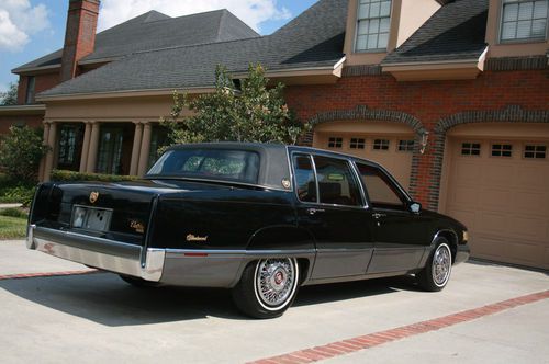 1989 stunning black/red cadillac fleetwood with 74,315 miles no rust-no wrecks
