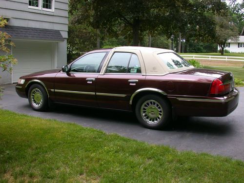 Dark red automatic, 69700 miles, new tires &amp; brakes, leather seats garage kept