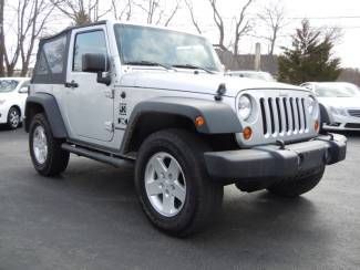 Like new 2009 wrangler silver black soft top 4x4 6sp manual with low 44k miles!