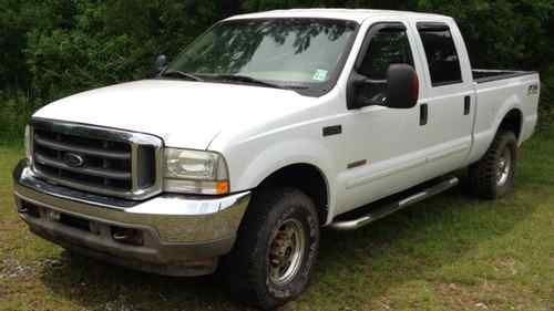 2003 ford f250 diesel 4x4 crewcab lariat  must sell!  read ad