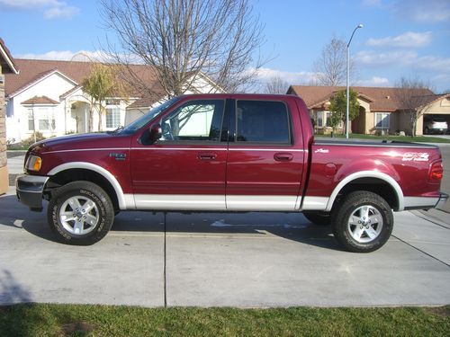 2003 ford f150 supercrew lariat 4x4, only 18k miles, loaded, leather, like new!!