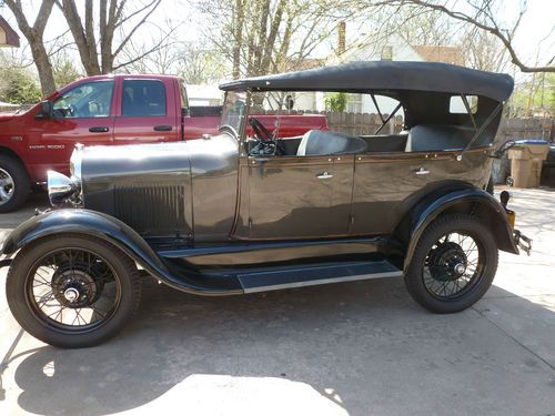 1929 model a ford phaeton. color rose beige.restored. bonney interior and top.