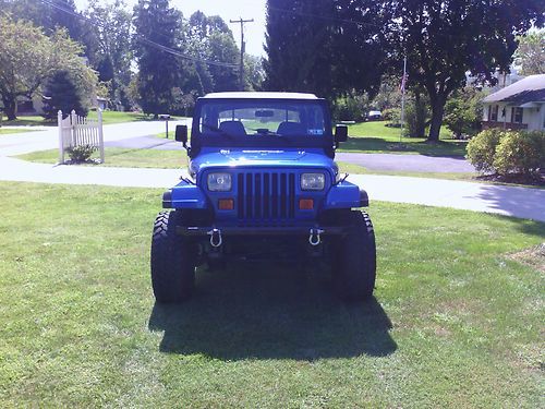 Blue jeep wrangler 4x4 4 cylinder 5speed manual trans