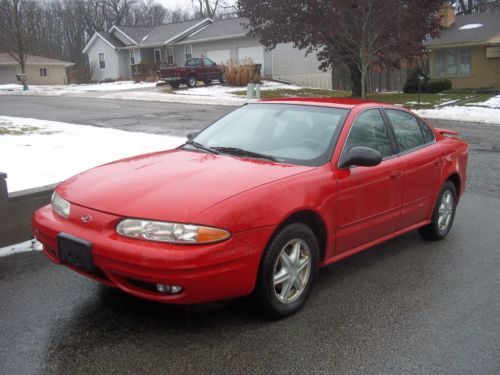 Red 2003 oldsmobile alero. runs great, 32 mpg. tow package! can deliver cheaply.