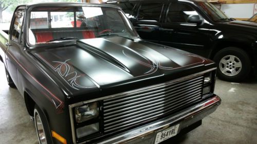 Black with red/black interior and in excellent condition