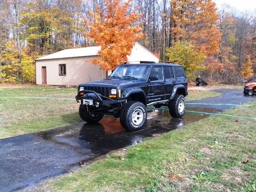 Professional ground-up build: black 1998 jeep cherokee sport with 4.6 stroker