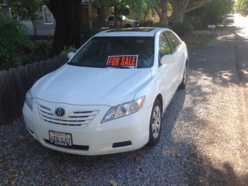2008 toyota camry white, 64000 mi. very clean,moon roof spoiler,no smoker, 1 own