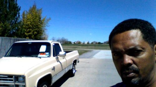 2 door chevy silverado tan &amp;white with mb rims &amp;tires runs and looks good.