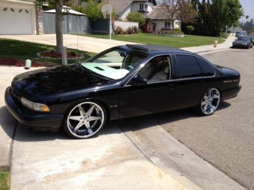 Completely customized, black, paint, white leather interior, 22&#034; big hommies