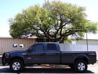 2006 green lariat 6.0l v8 4x4 long bed crew leather heated seats we finance!
