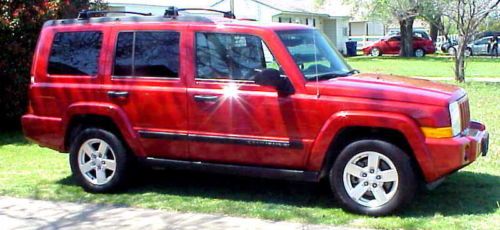 Red with leather interior and third row seating and a/c excellent condition