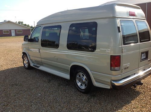 2004 ford e-150 hi-top conversion van.  very low mileage.  leather. dvd.