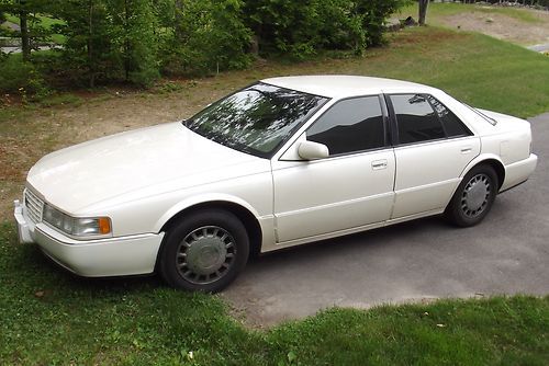 1994 pearl white cadillac seville sts