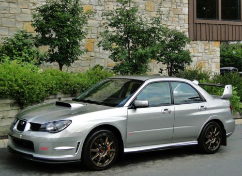Sti sedan, 99% stock, immaculate inside&amp;out, clean carfax, 1-owner, invidia spt