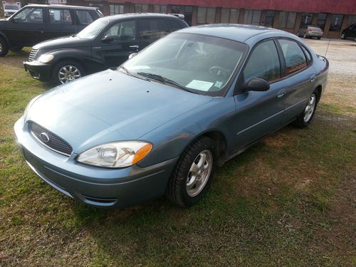 2007 ford taurus no reserve low miles cold ac!!!  brand new tires!!!!! warranty