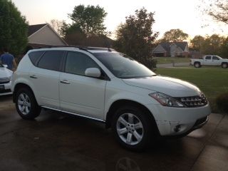 $8300 white/tan leather, good-fair condition, 204500 miles, most hwy, one owner