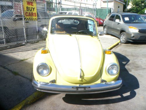Classic yellow volkswagen beetle convertible !  low miles , everything works :)