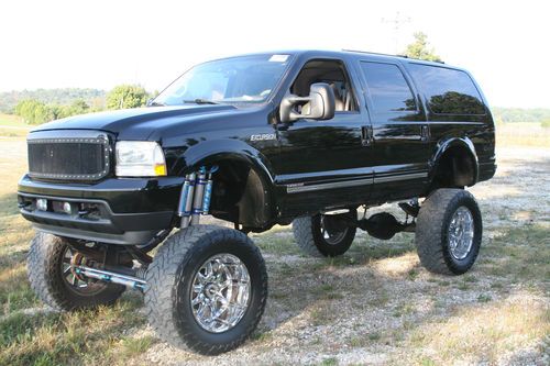 Ford 4x4 excursion 7.3 all jacked up and super clean.