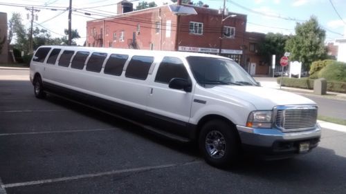 Great condition white 220 excursion limousine very low miles granite floors load