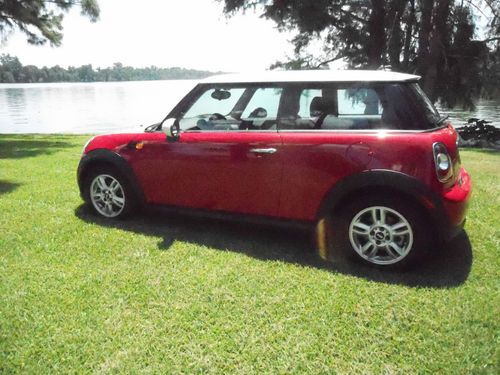 2012 red mini cooper with white racing stripes
