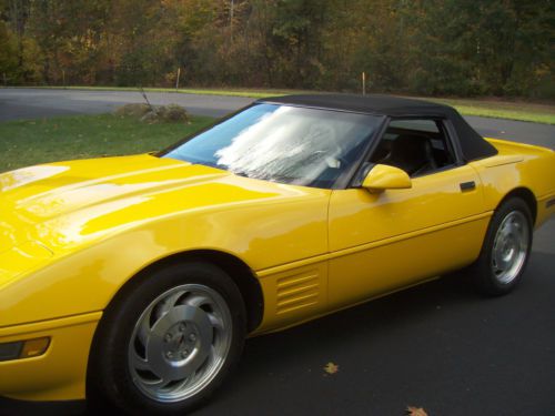 1994 yellow chevrolet corvette covert./black-six speed w/16,000 org.mi.exc.cond