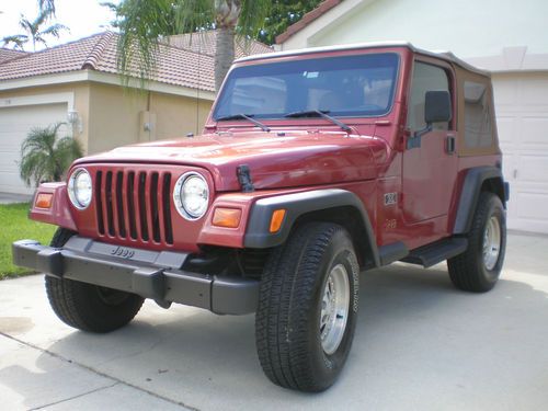 '98 jeep wrangler, 6 cyl, 4 wd, 5 spd with new top, tires and more