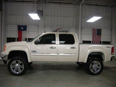 Power running boards,spray in bedliner, special chrome wheels and tires, 7" lift