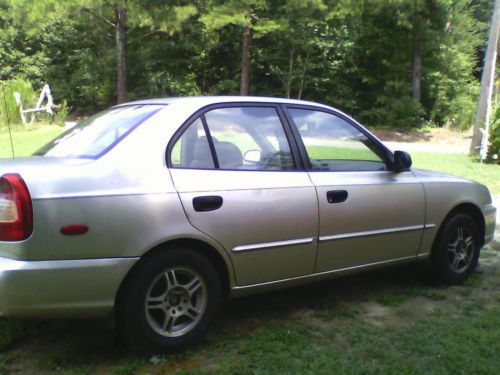 2000 hyundai accent needs work. new tires!! good gas mileage!! sold as-is.