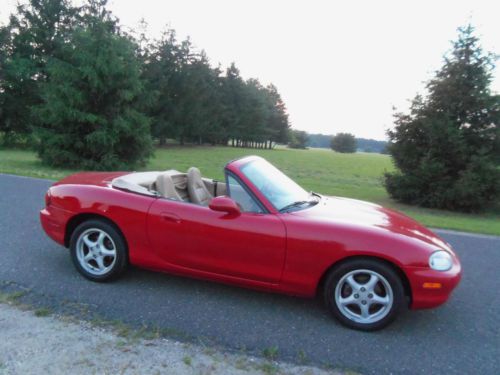 ** red/tan miata * $7000 in options * mint * new tires* must see * none nicer **