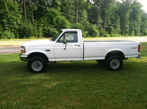 One owner , f-250 heavy duty 4x4 white ford long bed truck auto ,a/c,, gas 351