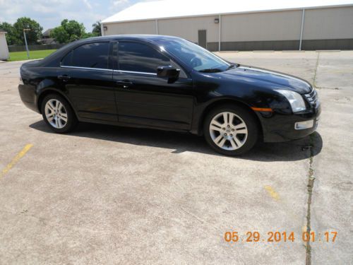 Ford fusion - black w/tan leather, (very nice)