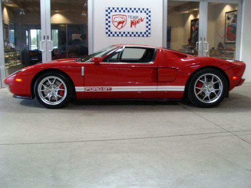 All 4 option ford gt - red w/ white stripes, still on mso, 741 miles, like new!!