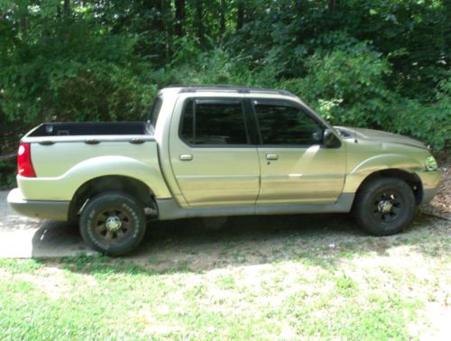 Gold ford explorer 4 door sport trac runs great, doesn&#039;t drive needs rear end