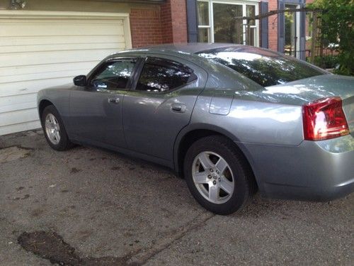 07 dodge charger grey sedan is in good condition.  drives good, sharp looking.