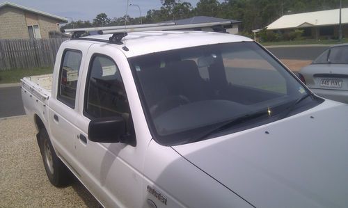 2005 ford courier gl tow ball, roof racks, good cond, minor rust, very cheap!