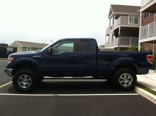 Lifted 2011 ford f150 metallic blue