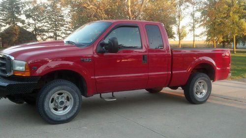 Red, extended cab, v-10 automatic,   108,000 miles.  after market front bumper.