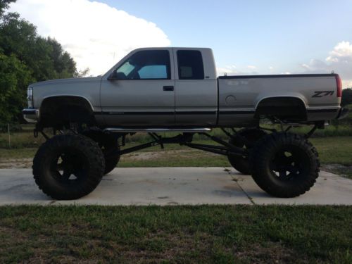 Mud truck, lifted ,monster truck ,chevy pickup, jacked up,