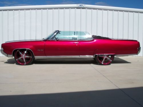 Candy red oldsmobile 98 convertable