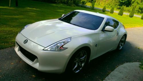 Pearl white nissan 370z sport touring package
