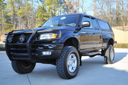 Tacoma ext cab 4x4 / 5 speed / nav / only 60k miles / stunning cond / a must see