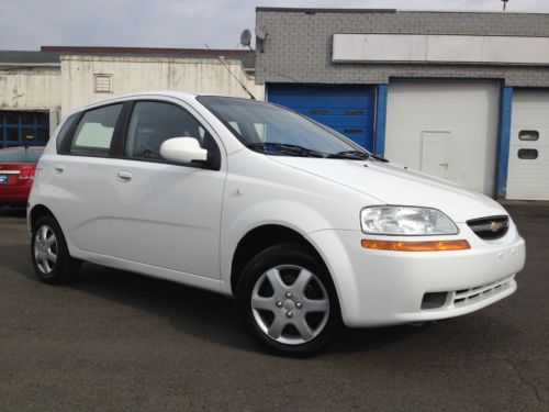 Clean carfax! great value with this 2006 chevy aveo ls 4dr hatchback good rubber
