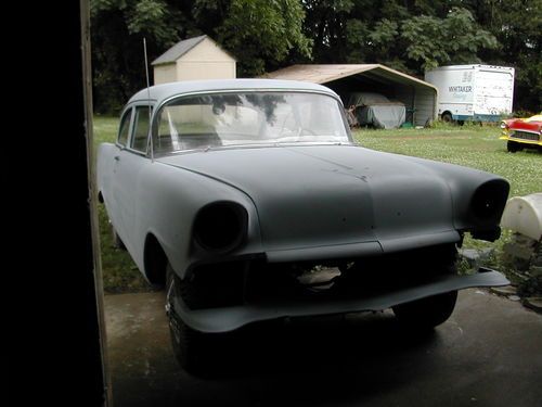 1956 -210 post chevy ,rolling car,striped &amp; primed, 4 speed,solid.