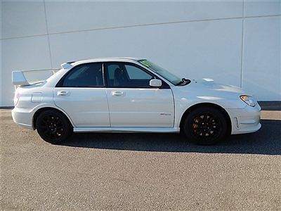 Low miles, high-power boxer engine, 6-speed stick, 17&#034; alloys, spoiler, more