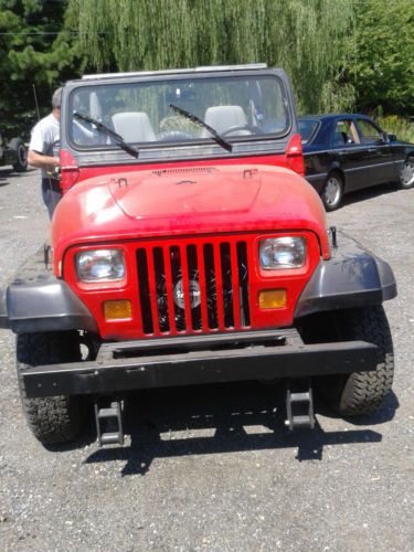 Red 1989 jeep wrangler